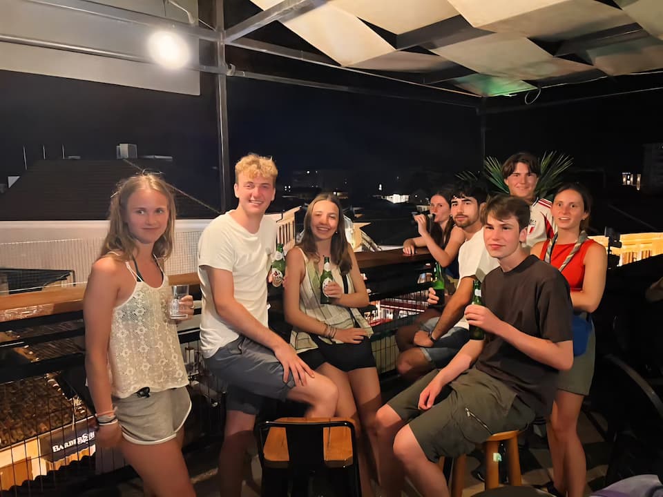 Relaxing on the rooftop terrace at Scodrinon Hostel