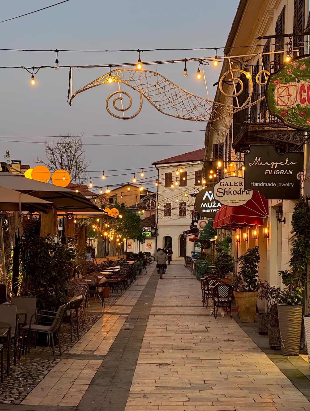 Kolë Idromeno pedestrian street life near Scodrinon Hostel